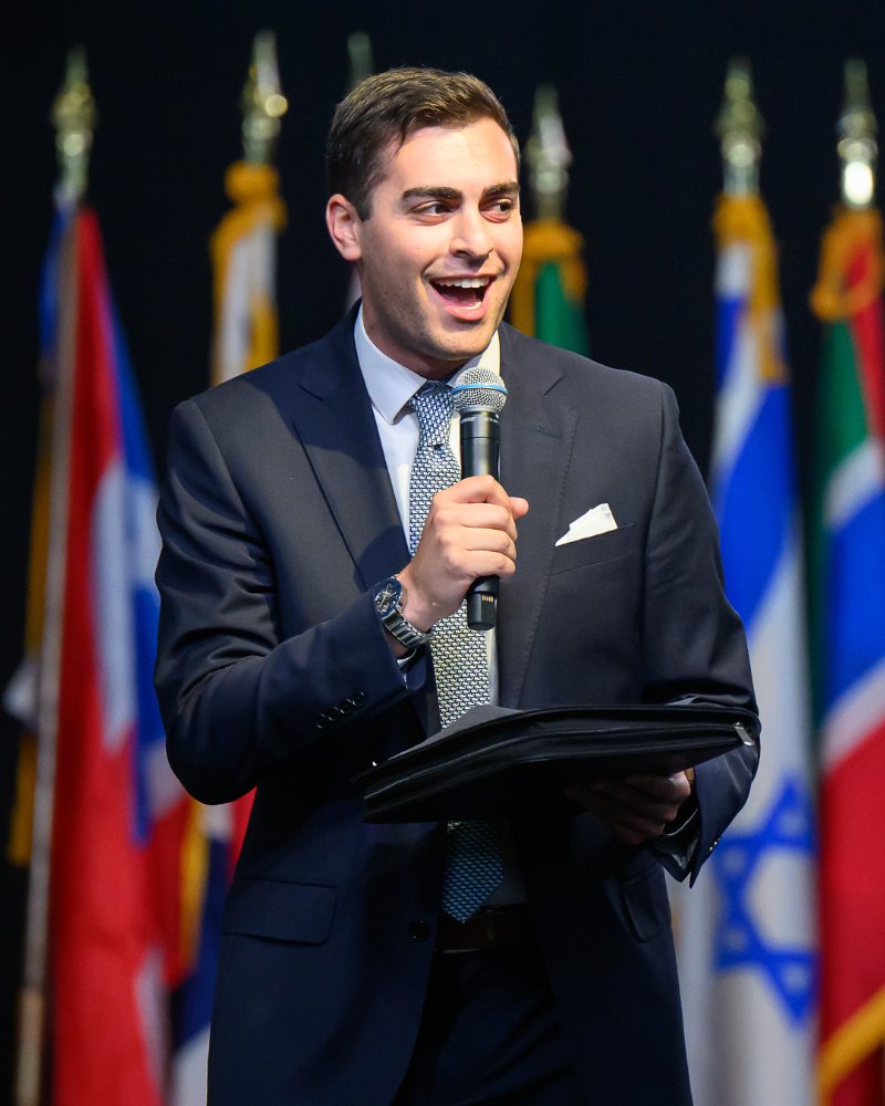 Michael Wolf on stage with a microphone